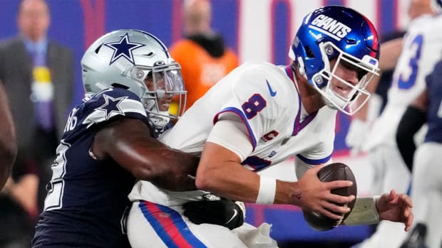 Sep 26, 2022; East Rutherford, NJ, USA; Dallas Cowboys defensive end Dorance Armstrong (92) tackles New York Giants quarterback Daniel Jones (8) during the second half at MetLife Stadium.