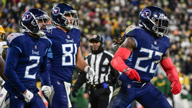 Tennessee Titans running back Derrick Henry (22) celebrates after scoring a touchdown in the second quarter against the Green Bay Packers at Lambeau Field.