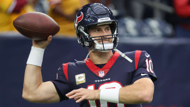 Texans quarterback Davis Mills warms up before the game vs. the Commanders.