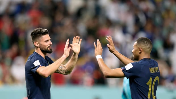 Olivier Giroud (left) and Kylian Mbappe pictured high-fiving during France's 4-1 win over Australia at the 2022 World Cup