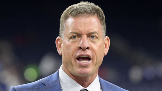 Former Cowboys quarterback and current Fox analyst Troy Aikman looks on prior to a game between the Texans and the Colts.
