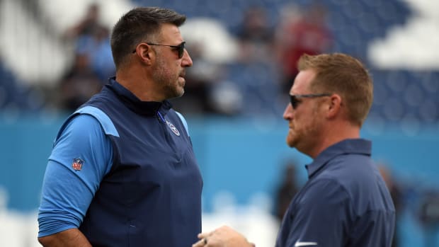 Titans head coach Mike Vrabel and offensive coordinator Todd Downing look on before a game.