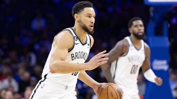 Nets’ Ben Simmons brings the ball up against the 76ers.