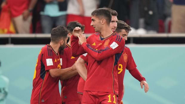 Ferran Torres pictured directing an "S" gesture towards his girlfriend, Sira Martinez, in the crowd after scoring in Spain's 7-0 win over Costa Rica at the 2022 World Cup in Qatar