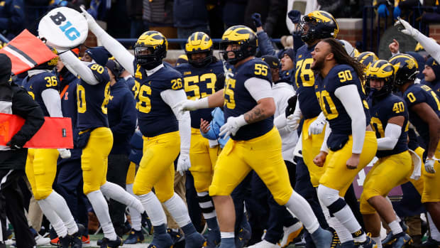 Nov 19, 2022; Ann Arbor, Michigan, USA; Michigan Wolverines Players celebrate after the game against the Illinois Fighting Illini at Michigan Stadium.