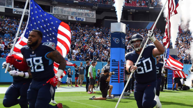 Tennessee Titans defensive tackle Jeffery Simmons (98) and center Ben Jones (60) take the field before the game against the New York Giants at Nissan Stadium.