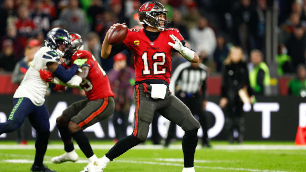 Nov 13, 2022; Munich, Germany, DEU; Tampa Bay Buccaneers quarterback Tom Brady (12) looks to pass against the Seattle Seahawks during the third quarter of an International Series game at Allianz Arena.