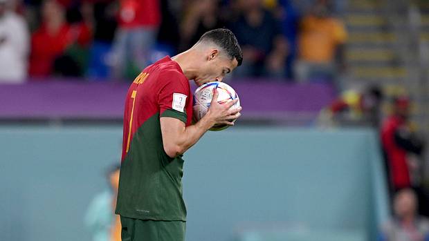 Cristiano Ronaldo pictured kissing the ball before converting a penalty against Ghana to score at his fifth FIFA World Cup for Portugal