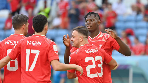 Xherdan Shaqiri (no.23) pictured hugging Breel Embolo following the striker's winning goal for Switzerland against Cameroon at the 2022 FIFA World Cup in Qatar