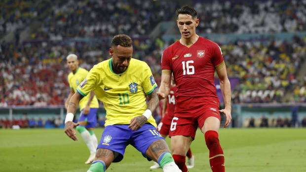 Nov 24, 2022; Lusail, Qatar; Brazil forward Neymar (10) kicks the ball past Serbia midfielder Sasa Lukic (16) during the first half in a group stage match during the 2022 World Cup at Lusail Stadium.