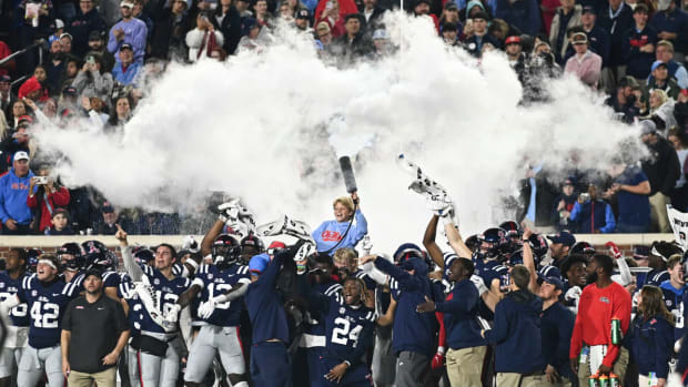 Ole Miss coach Lane Kiffin’s son Knox sprays a fire extinguisher over the team during the 2022 Egg Bowl.
