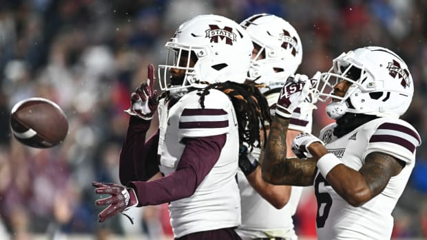 Mississippi State wide receiver Lideatrick Griffin reacts to scoring a touchdown with two of his teammates.