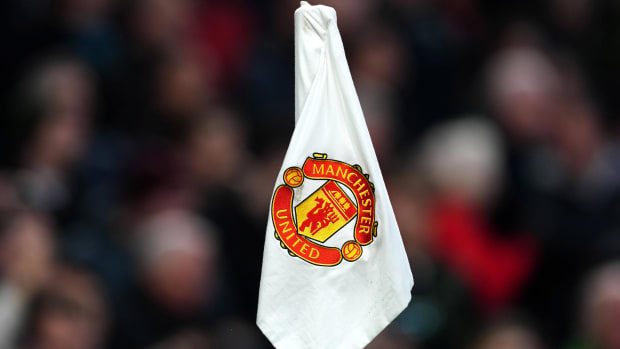 The Manchester United logo on a corner flag.