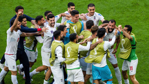 Iran celebrates a win against Wales.
