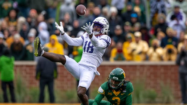 Nov 19, 2022; Waco, Texas, USA; TCU Horned Frogs wide receiver Savion Williams (18) catches a pass for a first down as TCU Horned Frogs safety Mark Perry (3) defends during the second half at McLane Stadium. Mandatory Credit: Jerome Miron-USA TODAY Sports