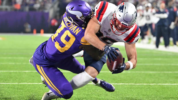 Nov 24, 2022; Minneapolis, Minnesota, USA; New England Patriots tight end Hunter Henry (85) catches a pass originally ruled as a touchdown as Minnesota Vikings cornerback Chandon Sullivan (39) defends. Instant replay would overturn the call and rule the play an incompletion during the third quarter at U.S. Bank Stadium. Mandatory Credit: Jeffrey Becker-USA TODAY Sports