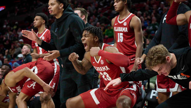 Alabama Crimson Tide forward Nick Pringle (23) celebrates a three point score with teammates during the second half against the Michigan State Spartans at Moda Center. Alabama won the game 81-70.