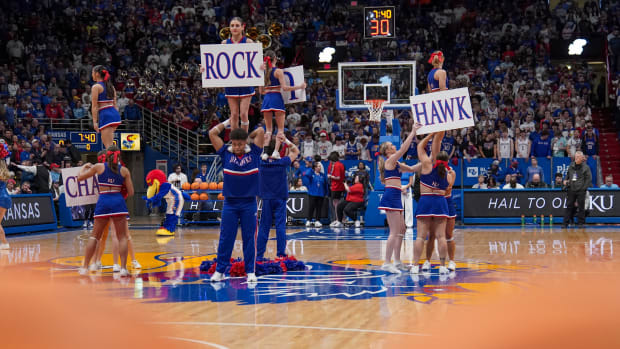 Jan 30, 2024; Lawrence, Kansas, USA; The Kansas Jayhawks cheerleaders perform against the Oklahoma State Cowboys prior to a game at Allen Fieldhouse. Mandatory Credit: Denny Medley-USA TODAY Sports  