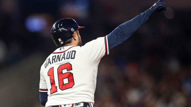 Oct 9, 2023; Cumberland, Georgia, USA; Atlanta Braves catcher Travis d'Arnaud (16) hits a two run home run during the seventh inning against the Philadelphia Phillies in game two of the NLDS for the 2023 MLB playoffs at Truist Park. Mandatory Credit: Brett Davis-USA TODAY Sports