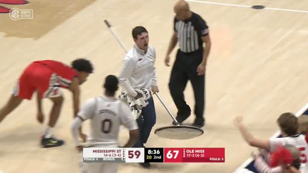 Student Manager Steals Show in Heated College Hoops Game With His Fired-Up Mopping Skills