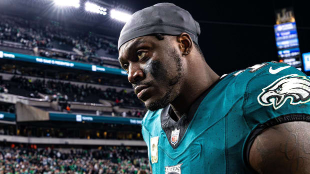Philadelphia Eagles wide receiver A.J. Brown looks on without a helmet after a game.
