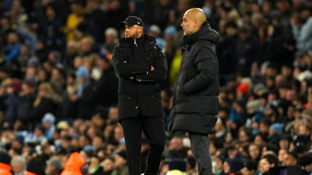 Managers Vincent Kompany (left) and Pep Guardiola pictured during Manchester City's 3-1 win over Burnley in January 2024