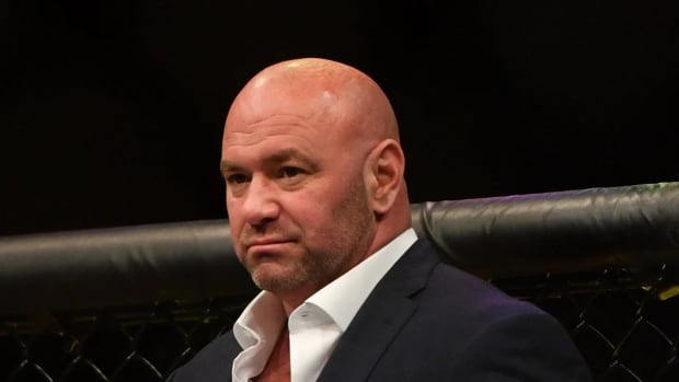 UFC CEO Dana White enters the Octagon following a fight.