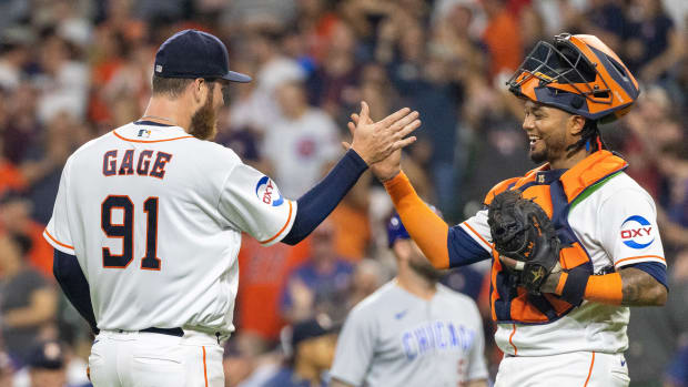 May 16, 2023; Houston, Texas, USA; Houston Astros relief pitcher Matt Gage (91) and catcher Martin Maldonado (15) react after defeating the Chicago Cubs at Minute Maid Park. Mandatory Credit: Thomas Shea-USA TODAY Sports