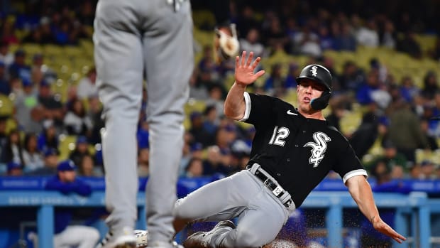 Jun 14, 2023; Los Angeles, California, USA; Chicago White Sox second baseman Romy Gonzalez (12) scores a run against the Los Angeles Dodgers during the ninth inning at Dodger Stadium.