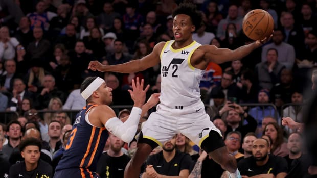 Utah Jazz guard Collin Sexton (2) attempts to save a ball from going out of bounds in front of New York Knicks guard Josh Hart (3) during the second quarter at Madison Square Garden.