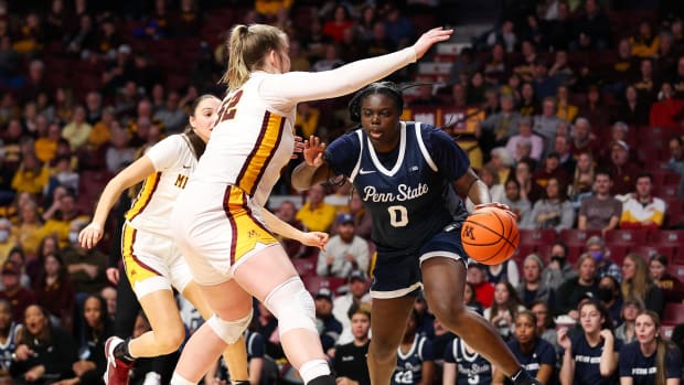 Penn State Nittany Lions guard Ashley Owusu (0) works around Minnesota Golden Gophers center Sophie Hart (52) during the second half at Williams Arena in Minneapolis on Jan. 31, 2024.