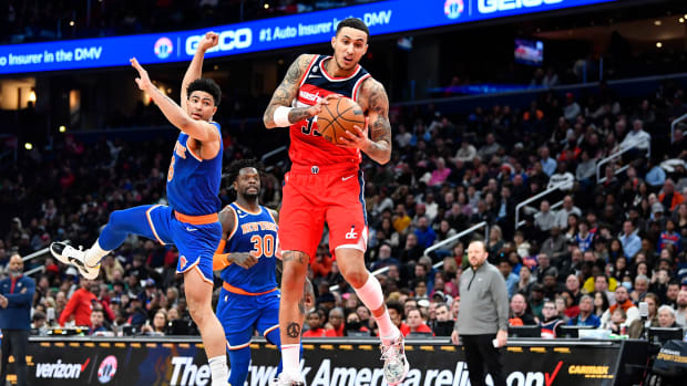 Feb 24, 2023; Washington, District of Columbia, USA; Washington Wizards forward Kyle Kuzma (33) catches the ball over New York Knicks guard Quentin Grimes (6) during the second half at Capital One Arena. Mandatory Credit: Brad Mills-USA TODAY Sports