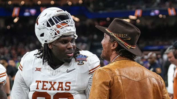 Actor Matthew McConaughey talks to Texas Longhorns defensive lineman T'Vondre Sweat (93) ahead of the Sugar Bowl College Football Playoff semifinals game against the Washington Huskies at the Caesars Superdome on Monday, Jan. 1, 2024, in New Orleans, Louisiana.
