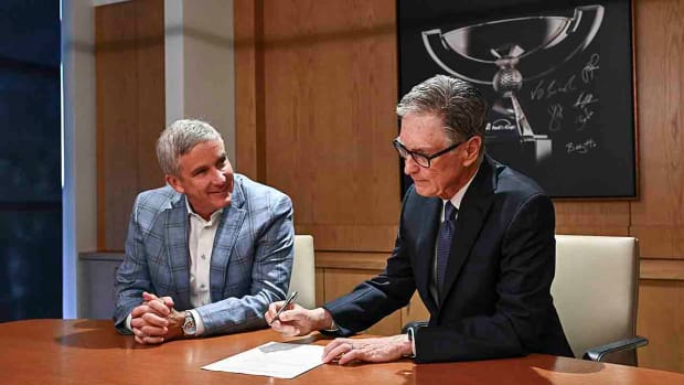PGA Tour commissioner Jay Monahan and John Henry, Principal, Fenway Sports Group, sign an agreement announcing the launch of PGA Tour Enterprises in partnership with Strategic Sports Group (SSG) Jan. 31, 2024, in Ponte Vedra Beach, Florida.