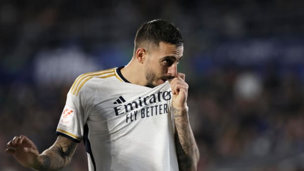 Joselu pictured kissing the badge on his Real Madrid jersey after scoring two goals in a 2-0 win at Getafe in February 2024