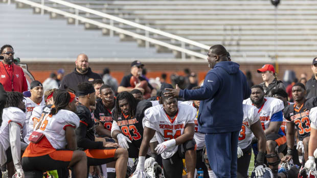 Feb 1, 2024; Mobile, AL, USA; American head coach Terrell Williams of the Tennessee Titans talks with his team after the third and final practice Thursday for the American team at Hancock Whitney Stadium. The team will play the National squad in the 2024 Senior Bowl in the same stadium Saturday.
