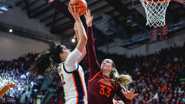 Edessa Noyan attempts a shot while Elizabeth Kitley defends during the Virginia women's basketball game against Virginia Tech at Cassell Coliseum.