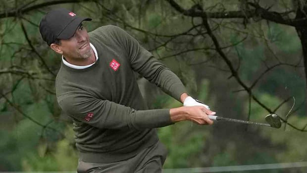 Adam Scott hits his second shot on the 10th hole during the first round of the 2024 AT&T Pebble Beach Pro-Am at Spyglass Hill Golf Course.