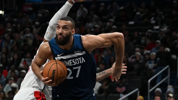 Jan 24, 2024; Washington, District of Columbia, USA; Minnesota Timberwolves center Rudy Gobert (27) moves past Washington Wizards center Daniel Gafford (21) during the first half at Capital One Arena.