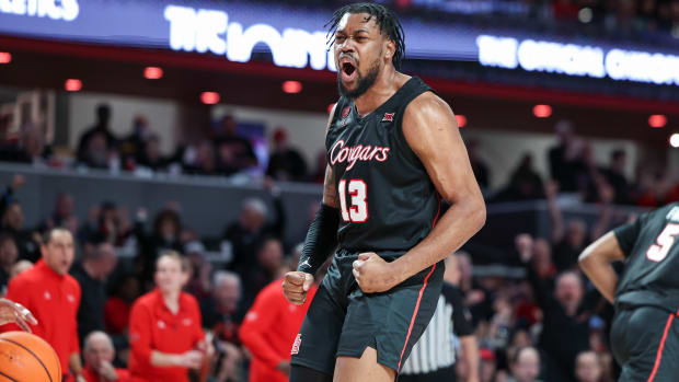 Jan 27, 2024; Houston, Texas, USA; Houston Cougars forward J'Wan Roberts (13) reacts after scoring a basket during the second half against the Kansas State Wildcats at Fertitta Center. Mandatory Credit: Troy Taormina-USA TODAY Sports  