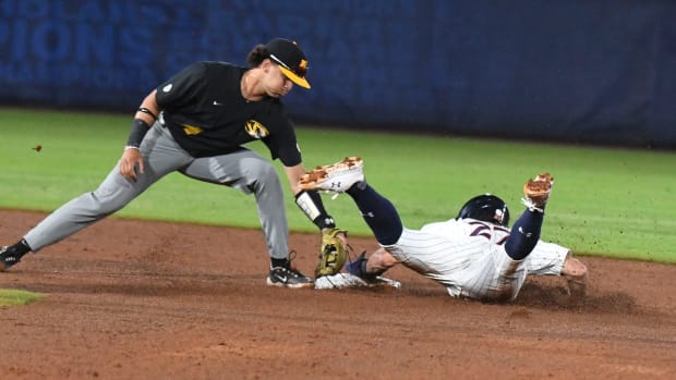 Auburn base runner Bobby Peirce slides into second for a steal as Missouri infielder Matt Garcia takes the throw during the opening round of the SEC Baseball Tournament at the Hoover Met Tuesday, May 23, 2023.