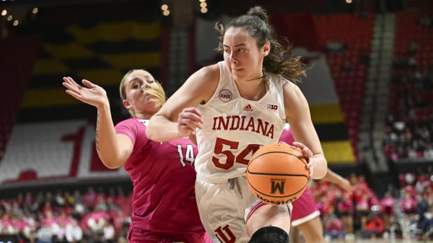 Jan 31, 2024; College Park, Maryland, USA; Indiana Hoosiers forward Mackenzie Holmes (54) makes a moe to the bakst on Maryland Terrapins forward Allie Kubek (14) during the first half  at Xfinity Center.