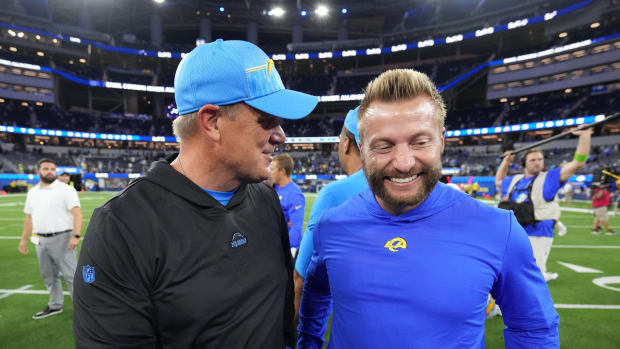 Aug 12, 2023; Inglewood, California, USA; Los Angeles Chargers defensive line coach Giff Smith (left) talks with Los Angeles Rams coach Sean McVay after the game at SoFi Stadium.