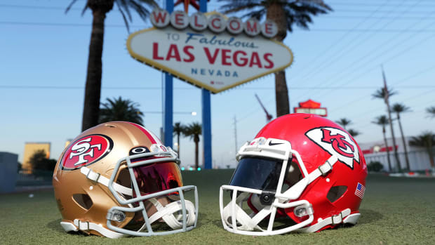 Helmets of the San Francisco 49ers and Kansas City Chiefs are featured in front of the “Welcome to fabulous Las Vegas” sign on Jan. 30, 2024.