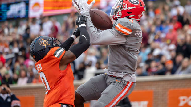 Feb 3, 2024; Mobile, AL, USA; American wide receiver Marcus Rosemy-Jacksaint of Georgia (1) grabs a touchdown pass over National defensive back Willie Drew of Virginia State (0) during the first half of the 2024 Senior Bowl football game at Hancock Whitney Stadium. (Vasha Hunt / USA TODAY Sports).