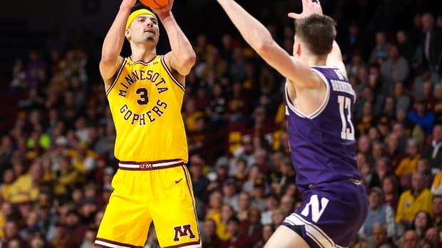 Minnesota forward Dawson Garcia (3) shoots as Northwestern guard Brooks Barnhizer (13) defends during the first half at Williams Arena in Minneapolis on Feb. 3, 2024.