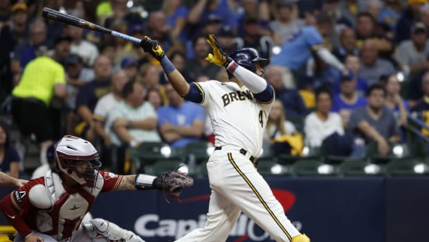 Oct 4, 2023; Milwaukee, Wisconsin, USA; Milwaukee Brewers first baseman Carlos Santana (41) hits a single in the third inning against the Arizona Diamondbacks during game two of the Wildcard series for the 2023 MLB playoffs at American Family Field.