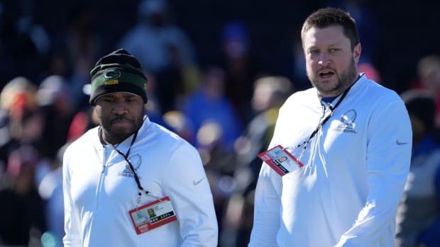 Feb 4, 2022; Las Vegas, NV, USA; Green Bay Packers defensive quality control coach Justin Hood (left) and offensive quality control coach Tim Zetts during NFC practice at the Las Vegas Ballpark.