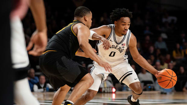 Vanderbilt Commodores guard Tyrin Lawrence (0) drives against Missouri Tigers guard Nick Honor (10) during their game at Memorial Gym in Nashville, Tenn., Saturday, Feb. 3, 2024.