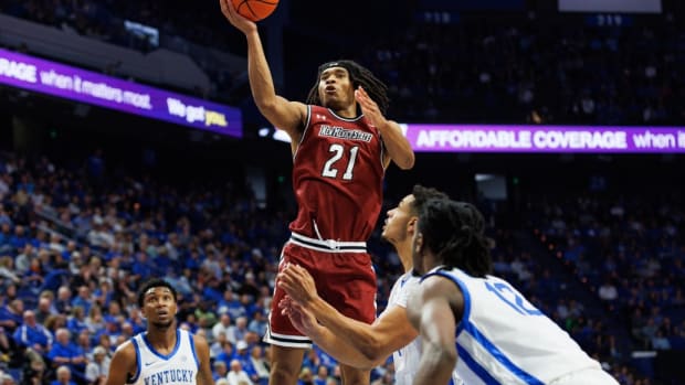 Nov 6, 2023; Lexington, Kentucky, USA; New Mexico State Aggies forward Robert Carpenter (21) goes to the basket during the first half against the Kentucky Wildcats at Rupp Arena at Central Bank Center.